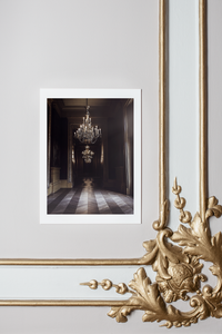chandeliers in palace interior, French interior, Paris, brown shades in background, herringbone floors, soft light, fine art print with white borders on ornamental wall with gold details